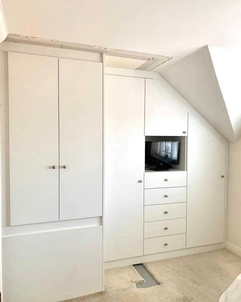 Loft bedroom conversion with fitted wardrobes in Watford