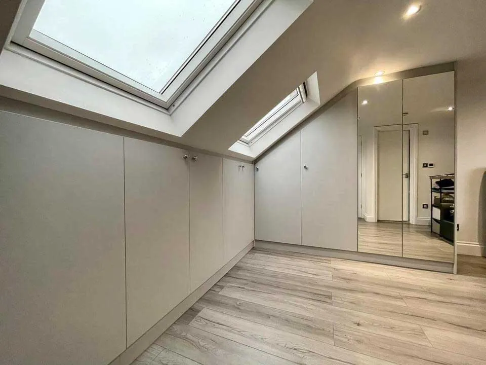 Loft conversion with Velux windows and fitted wardrobes in Hounslow